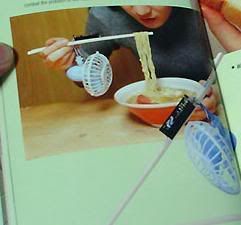 Noodles-instamatic-chopsticks-with-a-fan-thingamajig. 