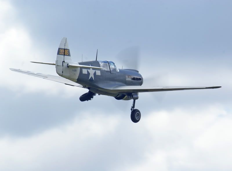 http://i56.photobucket.com/albums/g194/tigercatfan/Legends/P40-Take-off.jpg