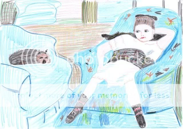 a little girl in a blue armchair